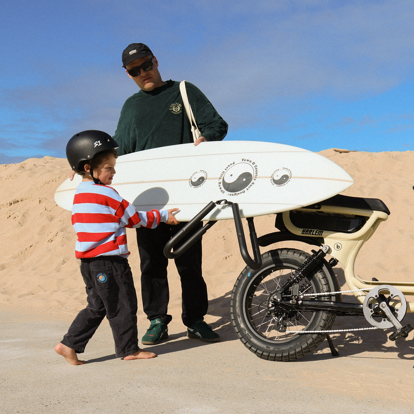 Fatboy shortboard surf rack carrying a surfboard on an e-bike