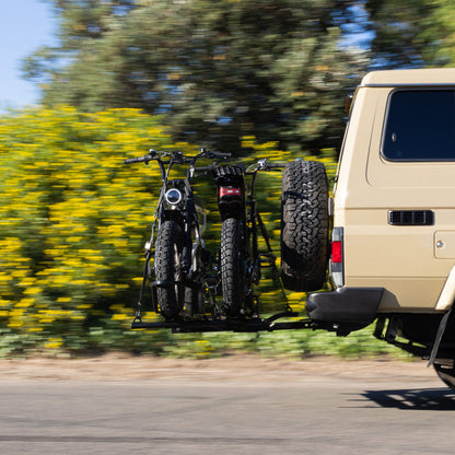 Fatboy Bang Bang bike carrier loaded with two Fatboy e-bikes on a towbar