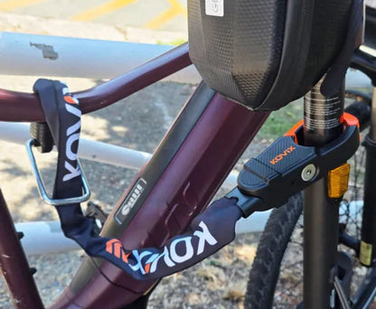 Kovix Scorpion alarm chain lock secured to a bike wheel | Grace & Pace Electric Bikes