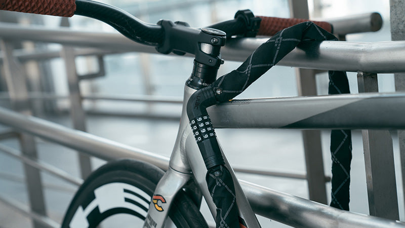 Ulac Steel Kombat chain lock securing a bicycle