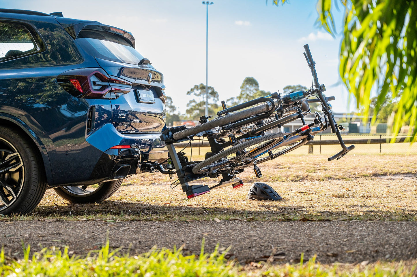 Buzzrack E-Scorpion 2 tilted down for boot access with bikes loaded