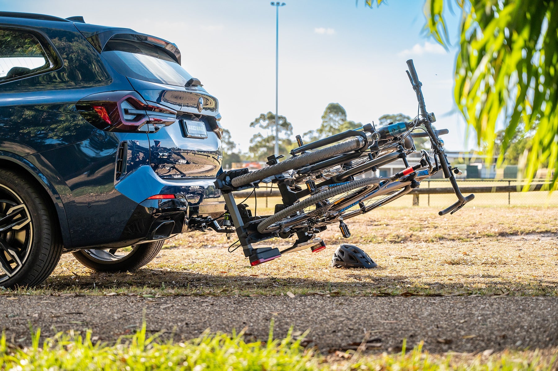 Buzzrack E-Scorpion 2 tilted down for boot access with bikes loaded
