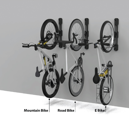 Skwiki Foldable Swivel Bike Wall Hanger in black, folded against a wall